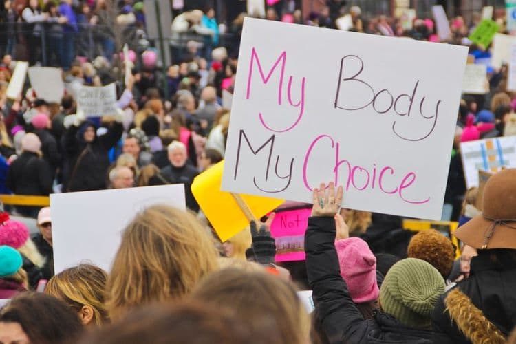 Photo of protesters holding a "My body my choice" sign